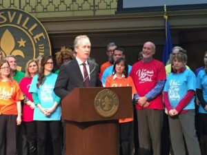 Louisville Mayor Greg Fischer publicly launches YES! Fest. Bernheim's Mark Wourms  stands behind him as a co-chair of the initiative. 